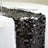 Black sequin table runner on a white tablecloth