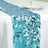 Turquoise sequin table runner for festive table decor.