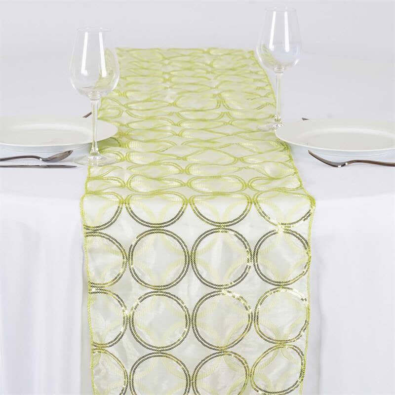 Green and silver circular pattern table runner on a white tablecloth #whtbkgd