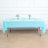 Light blue tablecloth draped over a table set for dining.