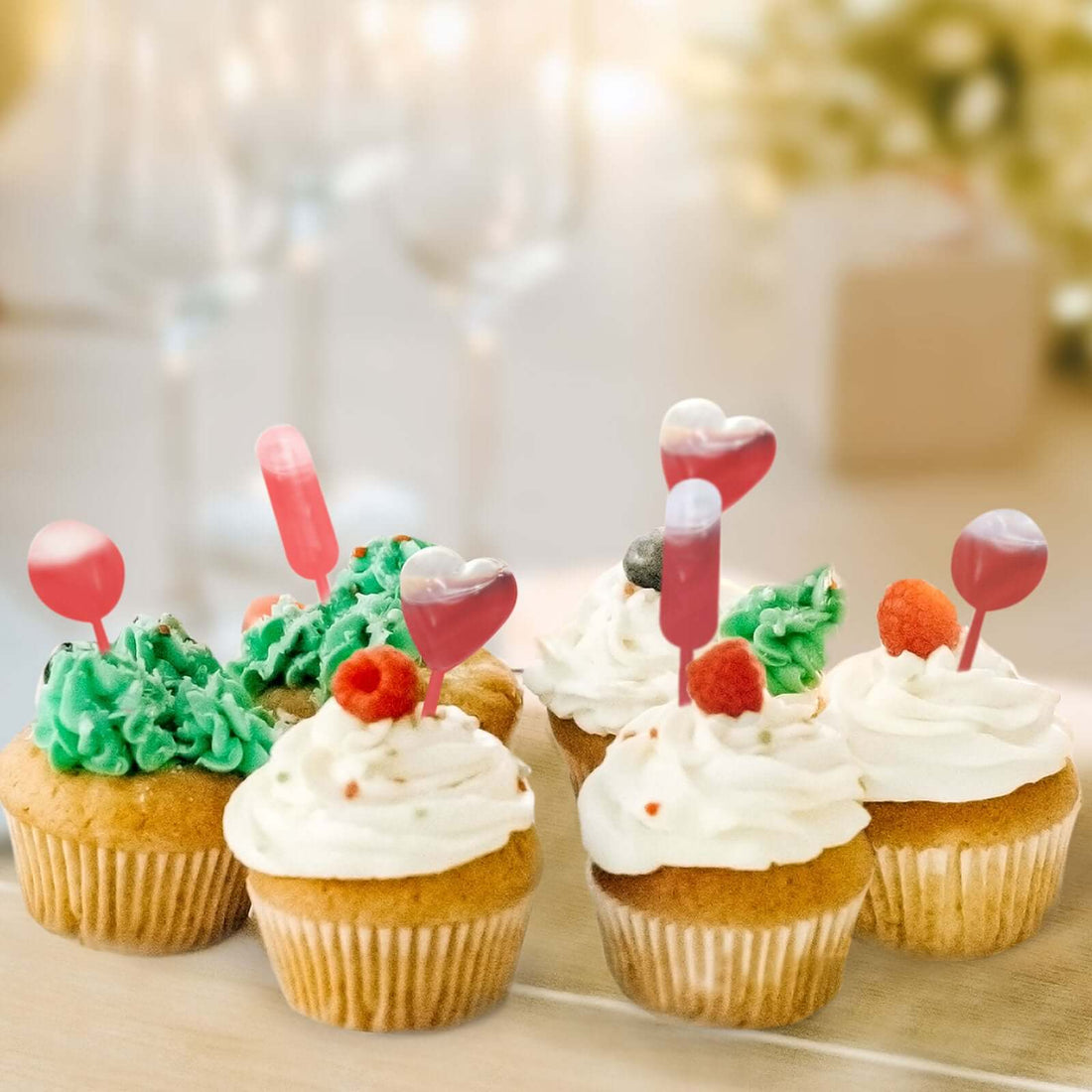 Colorful cupcakes with festive decorations for a celebration.