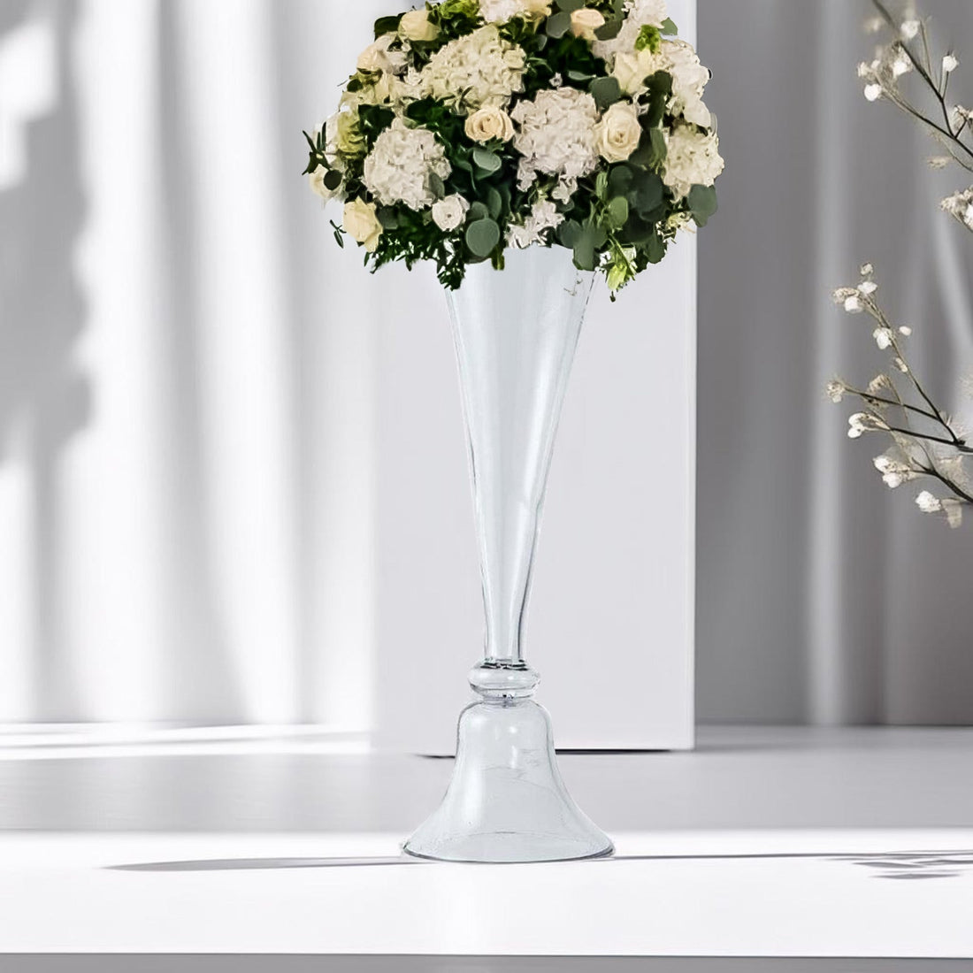 Elegant glass vase with white floral arrangement