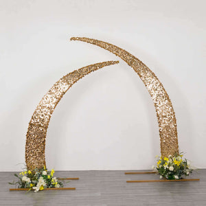 Gold crescent arch with flowers, perfect for weddings and events.