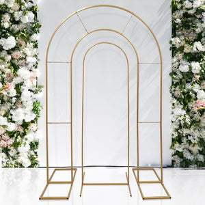 Gold metal arch backdrop for events and weddings. Elegant floral arrangement.