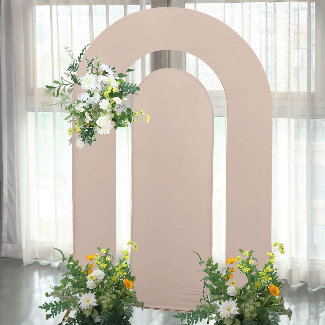 Arch backdrop with floral arrangements for events and photography.