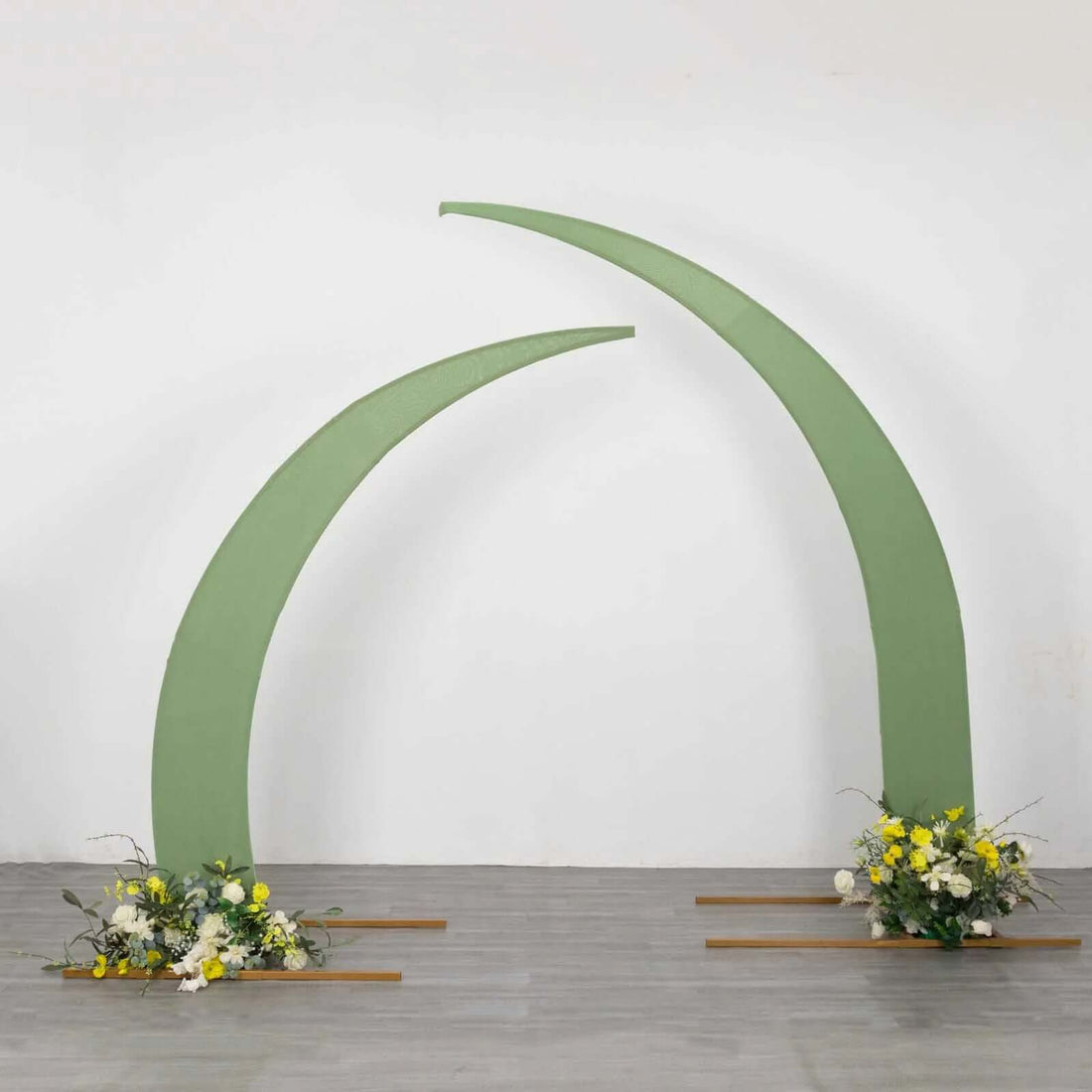 Green archway with floral arrangements for events or weddings