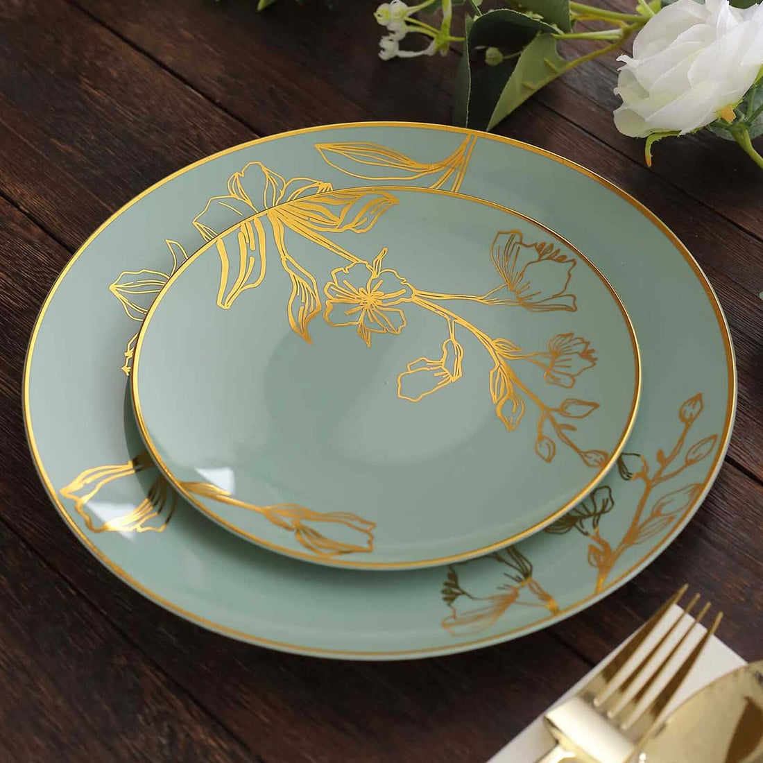 Elegant floral dinner plates in mint green with gold accents.