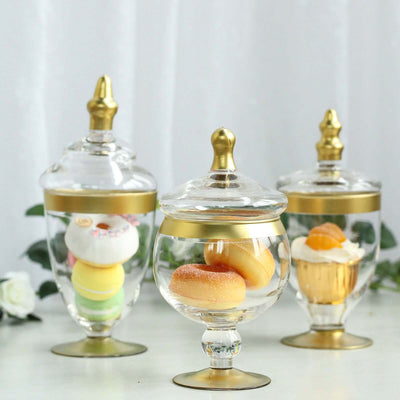 Set of 3 Clear Glass Jars 8.5", 9", 10" Apothecary Design with Gold Trim and Snap-On Lids - Decorative Footed Candy Buffet Containers