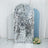 Sequin backdrop in silver tones with soft curves and floral arrangement