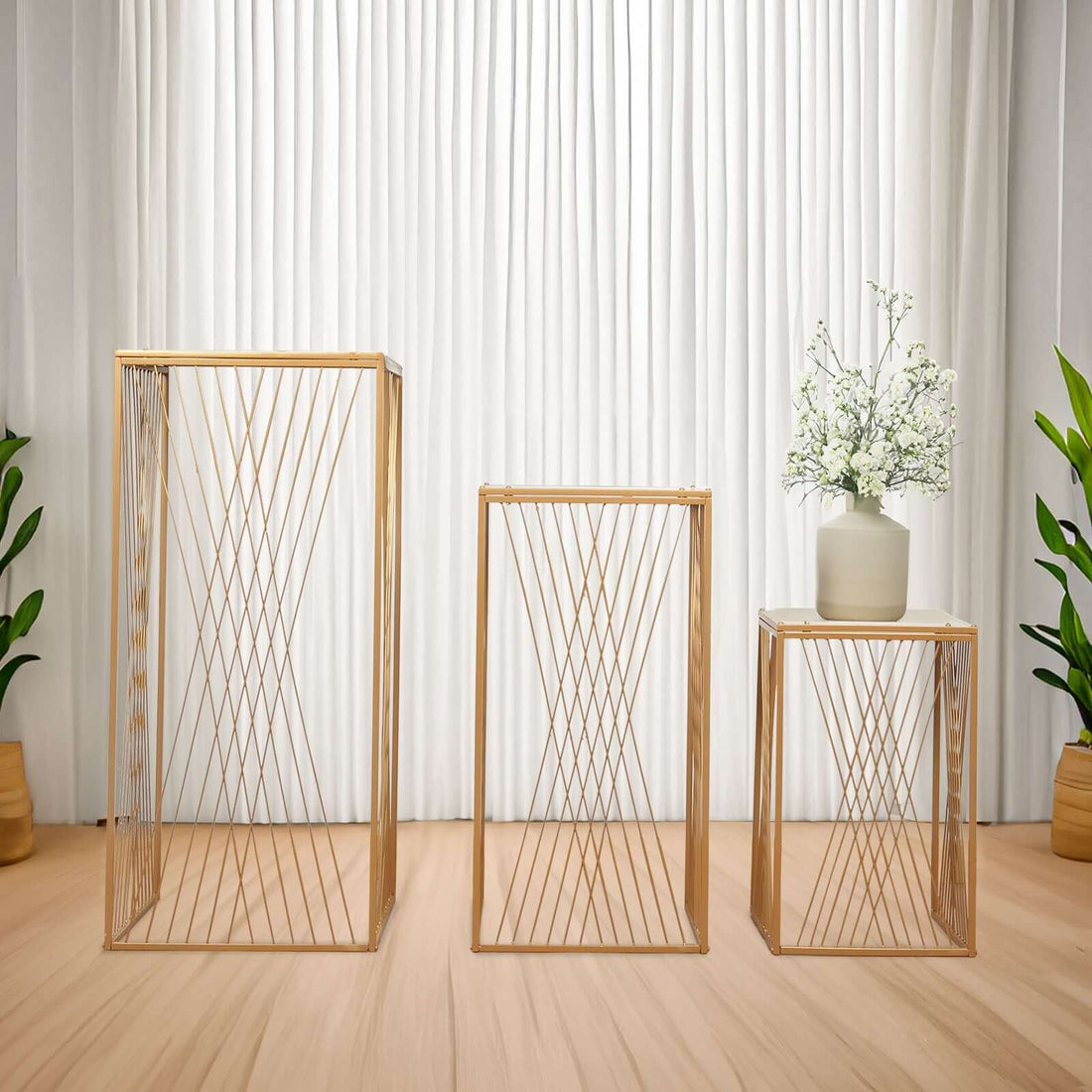 Modern geometric wooden side tables in a stylish living room setting.