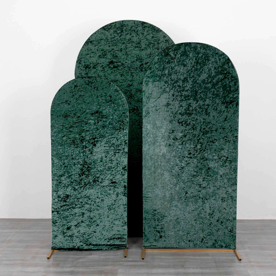 Green textured arch panels in various sizes on a plain backdrop.