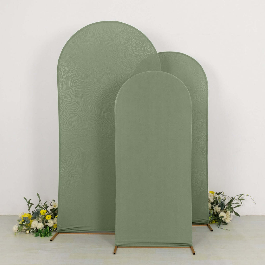 Set of three green fabric backdrops with rounded tops against a white background.
