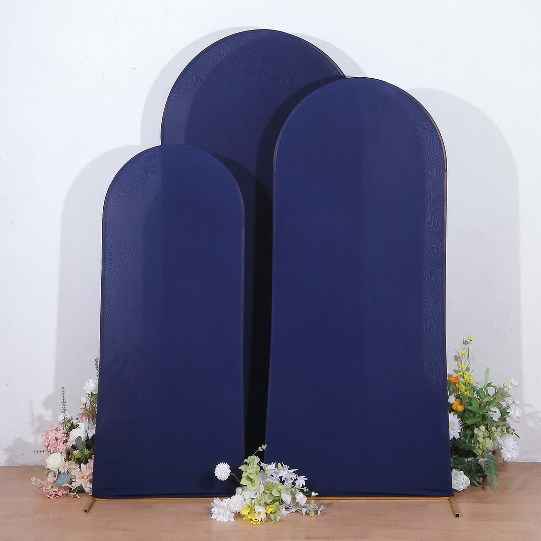 Navy blue arch-shaped display boards with floral accents