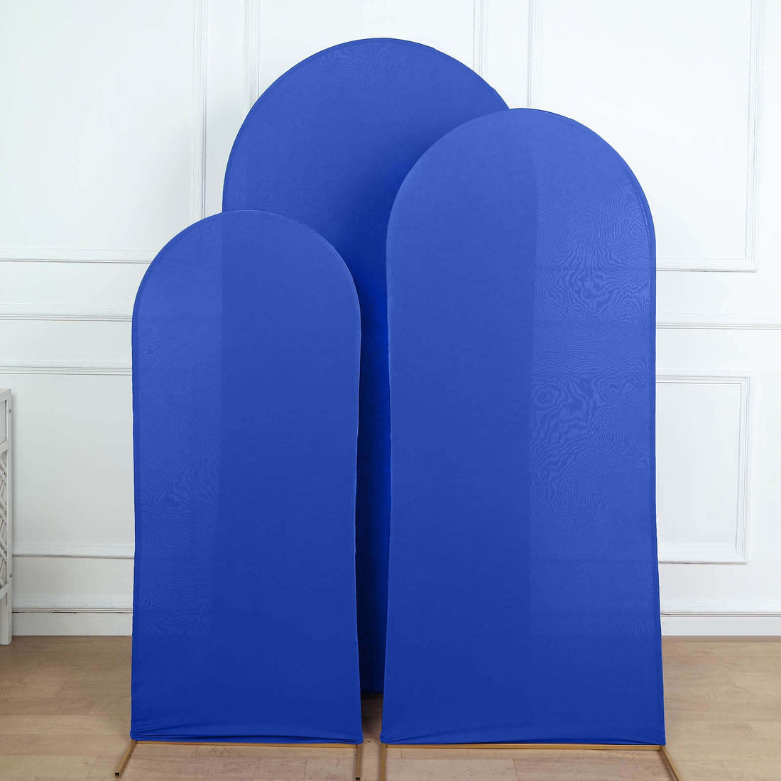 Three blue fabric screens in varying heights, set against a plain background.