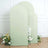 Green fabric backdrops with floral arrangements in front.