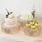 Elegant cake stands with floral decorations and desserts for celebrations.