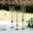 Elegant glass candle holders with gold accents, perfect for dining table decor.