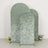 Three textured green backdrops with arch shapes, styled with flowers at the base.