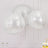 Three shimmering silver pendant lights hanging from the ceiling.