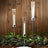 Elegant candle holders with lit candles against a wooden backdrop.