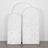 Three arched white fabric backdrops in varying heights on a plain surface.