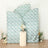 Decorative panels with floral pattern and a pedestal table with flowers.