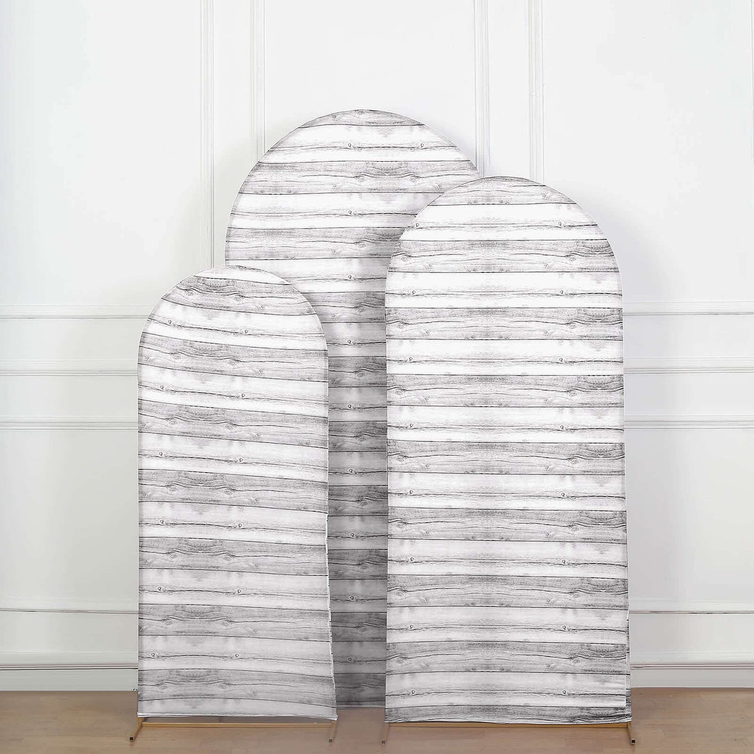 Three decorative arched panels with a distressed wood design.