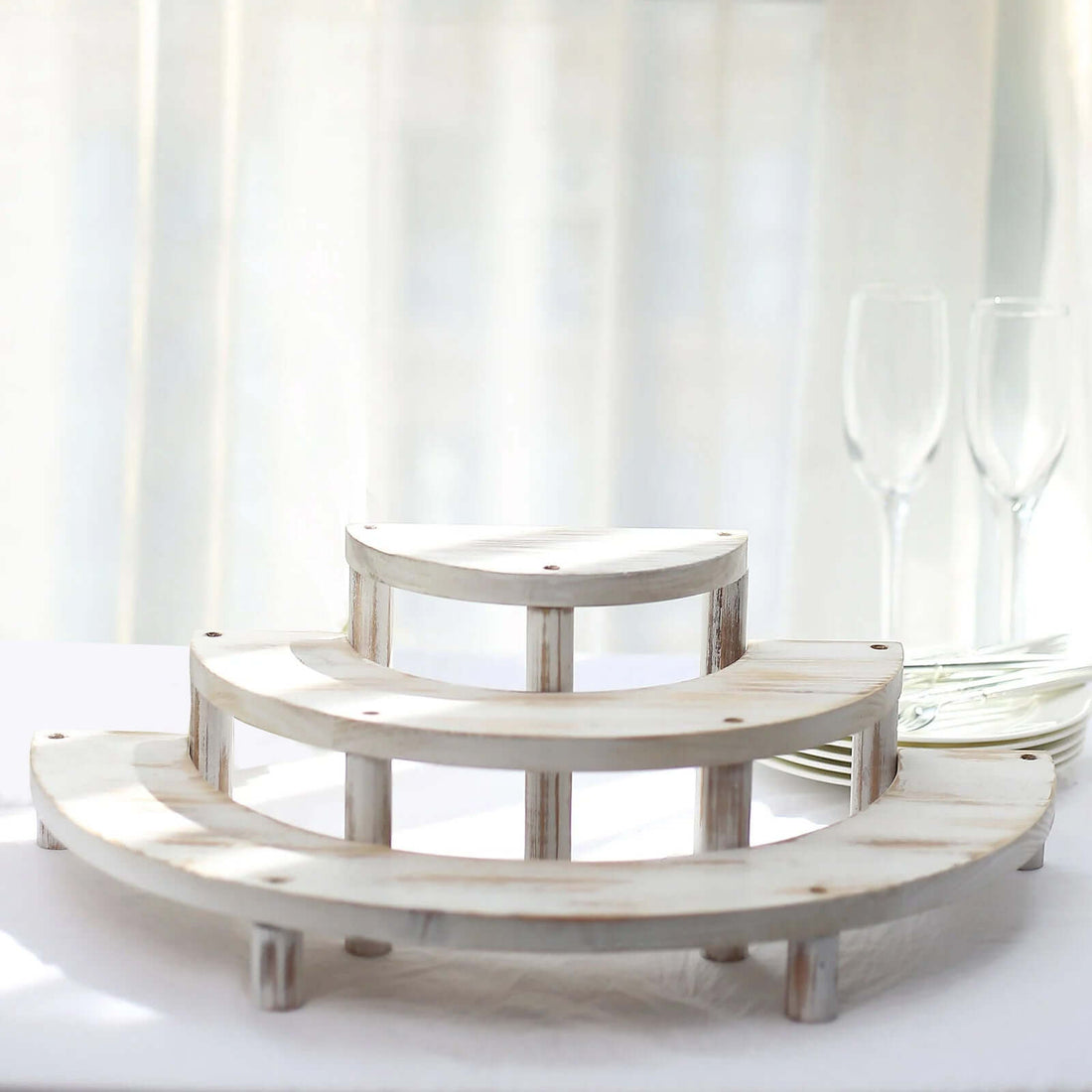 Three-tiered wooden display stand for elegant presentations.