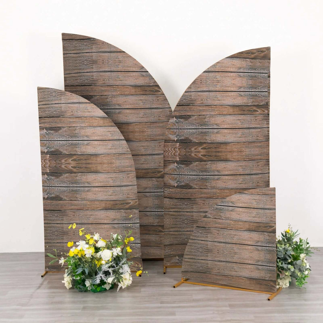 Wooden backdrop panels with a natural finish and floral arrangement in front.