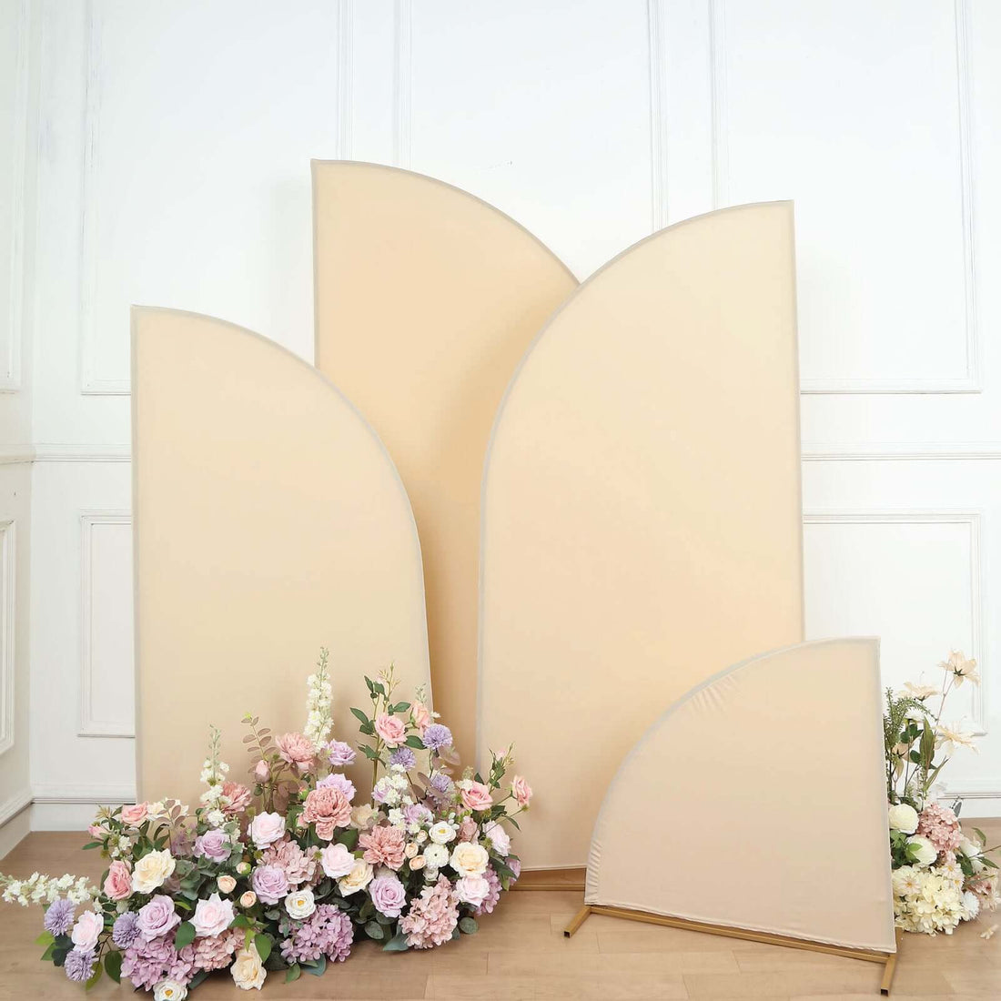 Decorative beige backdrops with floral arrangement in a studio setting.