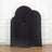 Black arch backdrops in various sizes against a white wall.