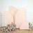 Peach backdrop panels with floral arrangements in a studio setting.