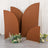 Decorative brown backdrops with floral arrangements in a studio setting.