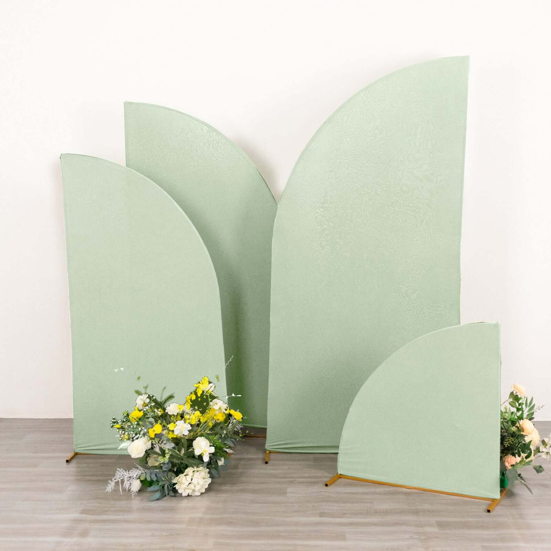 Green decorative panels with floral arrangement in front.