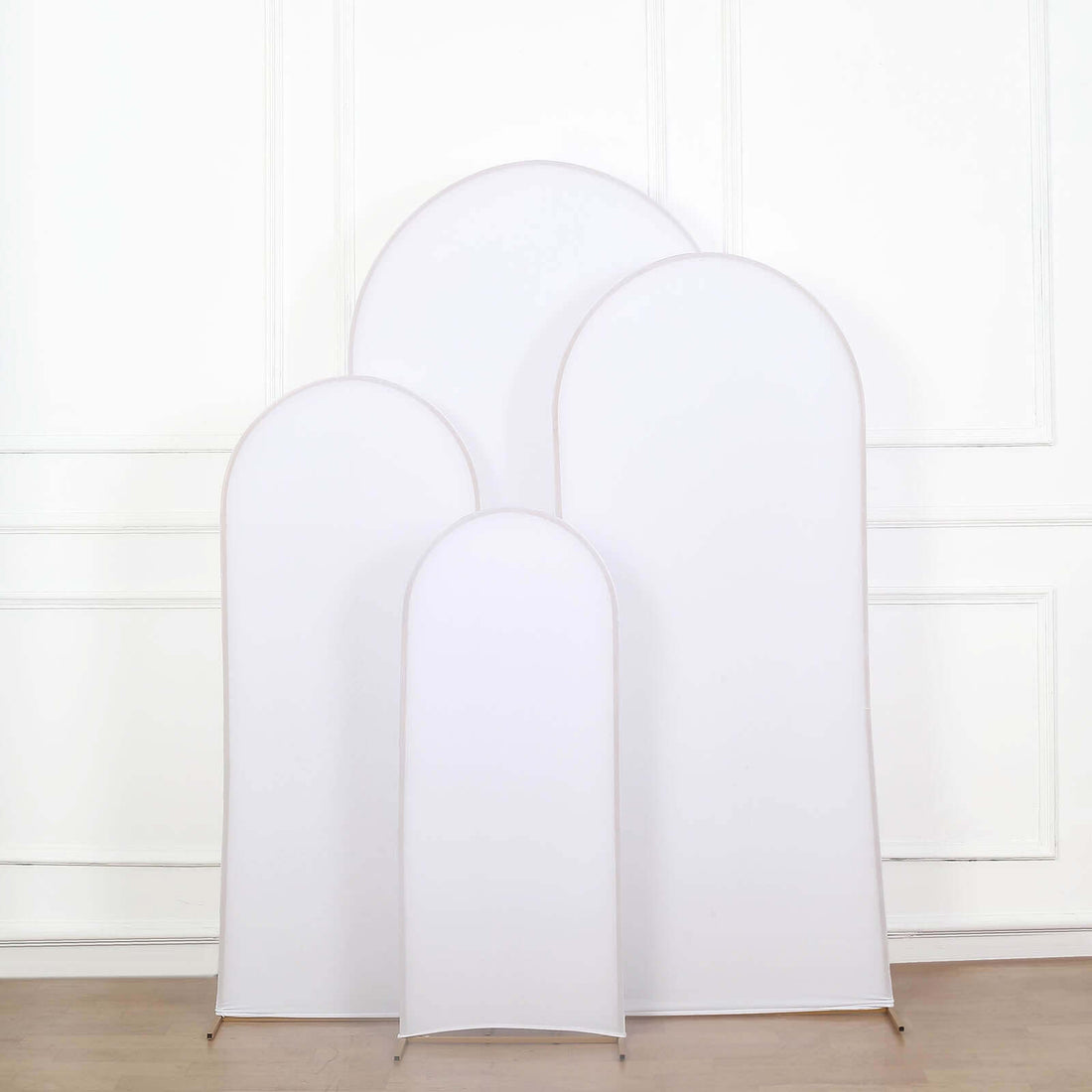 White fabric display stand set in various sizes on a plain background.