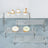 Acrylic display stands with cupcakes and desserts arranged on various levels.