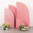 Glittery pink backdrops with floral arrangements in front of them.