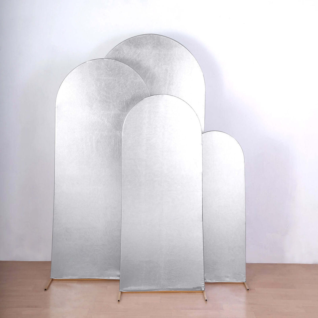 Silver photography backdrops in three sizes on a plain background