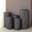 Decorative black and white patterned vases in various sizes.