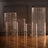 Clear acrylic vases with suspended beads in various heights