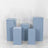 Blue display pedestals of varying heights arranged in a group