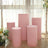 Pink display pedestals in various heights, set against a soft, natural background.
