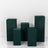 Green display pedestals in various heights on a white backdrop