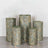 Decorative cylindrical stools with green and gold patterns, arranged in a group.