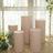 Set of five beige display pedestals in a bright, airy setting.