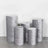Set of five decorative gray pedestals in various heights and shapes.
