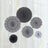 Black and white decorative paper fans in various designs.