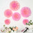 Pink paper flower wall decor in various sizes on a white background.