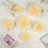 Creamy floral decorations arranged artistically on a soft background.