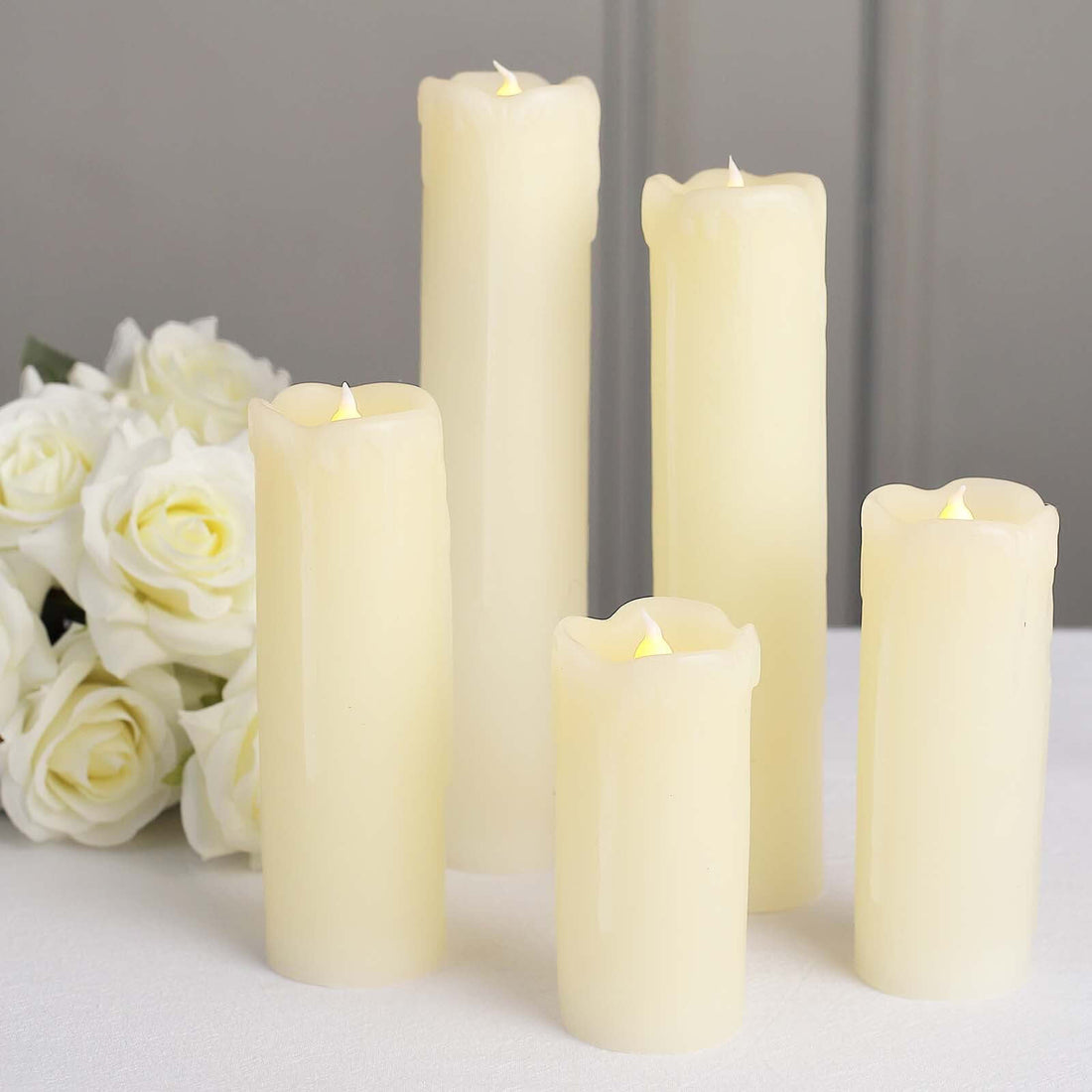 Set of five ivory LED candles with realistic flickering flames.